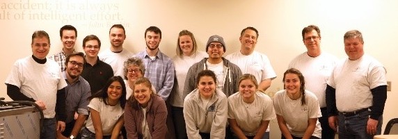 students posing with teachers