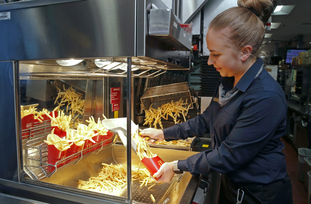 A McDonald’s employee cooks French fries using advanced kitchen equipment at a restaurant outside Chicago, IL. The company will begin a global test of several kitchen innovations this year focused on making the jobs of employees easier. Handout photo/McDonald's Corporation