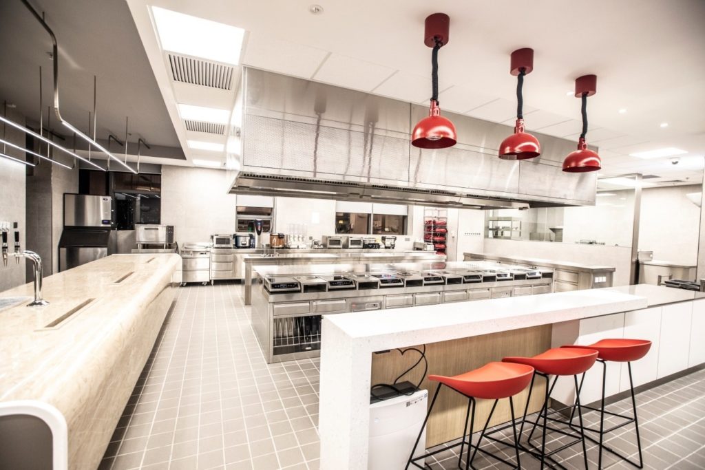 The test kitchen features state-of-the-art equipment and open communal areas